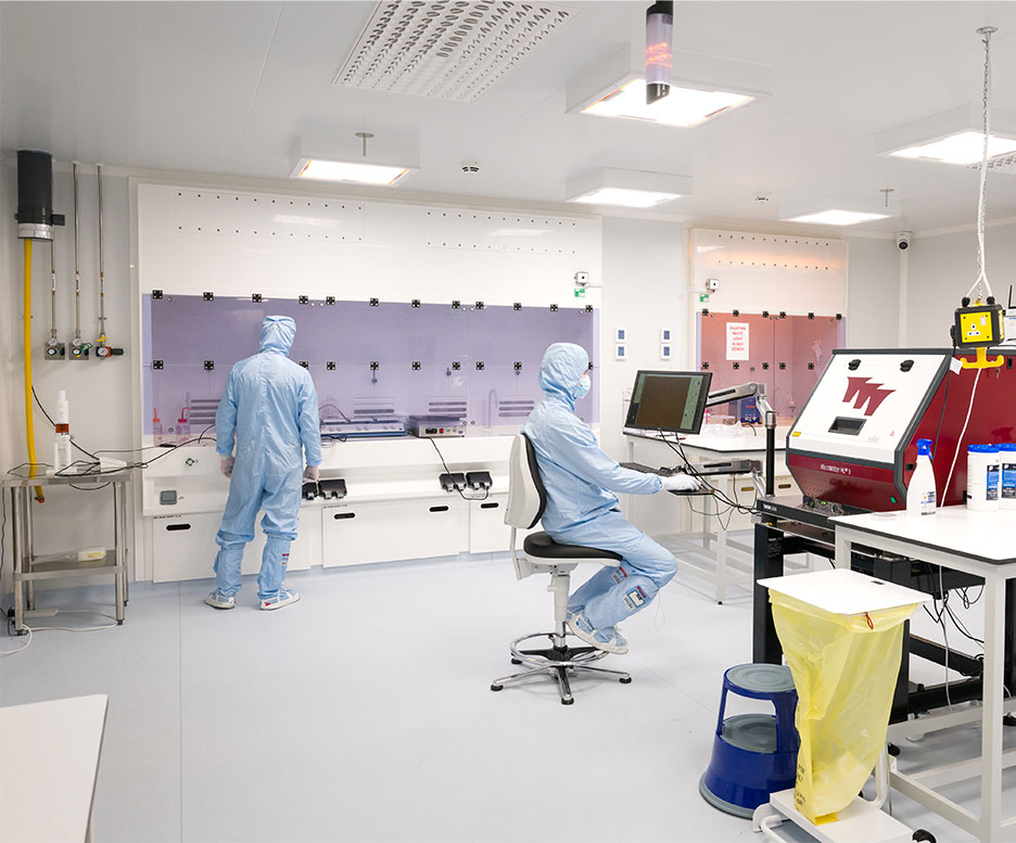 Technicians working in the cleanroom.