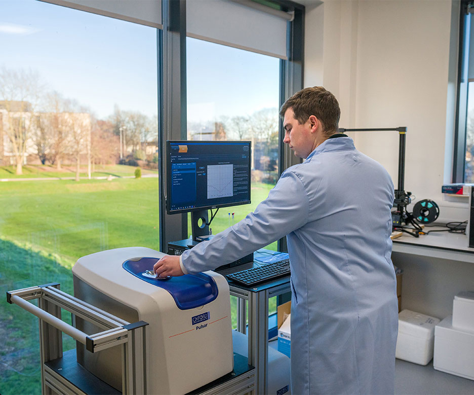 man working with machine in lab