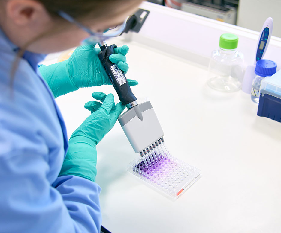 lady working with microscope