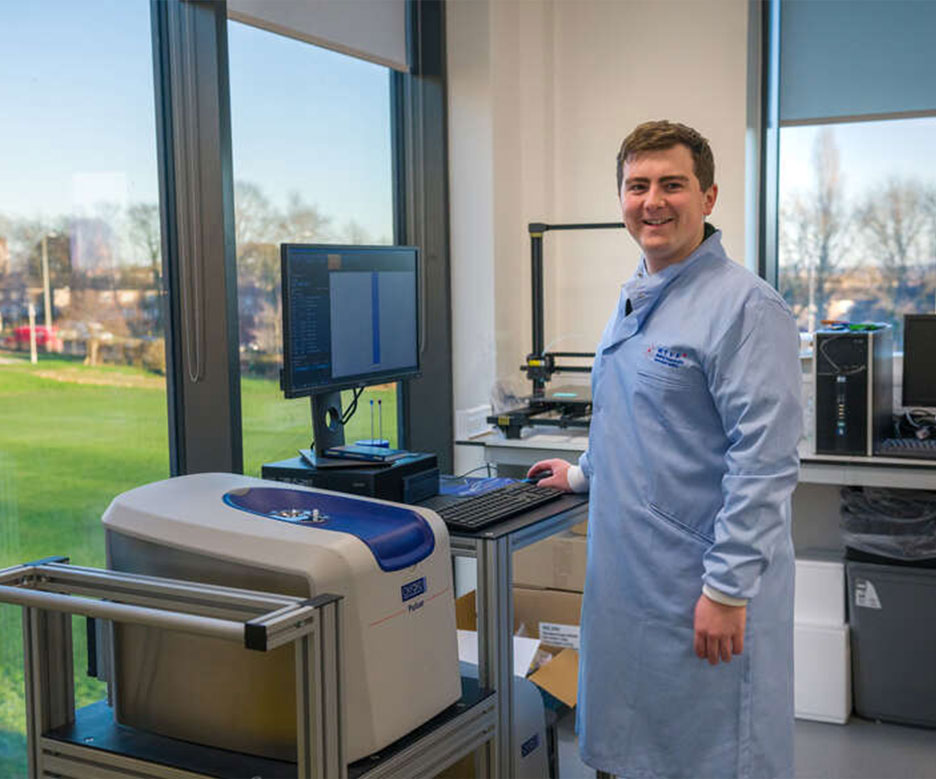 man smiling in laboratory