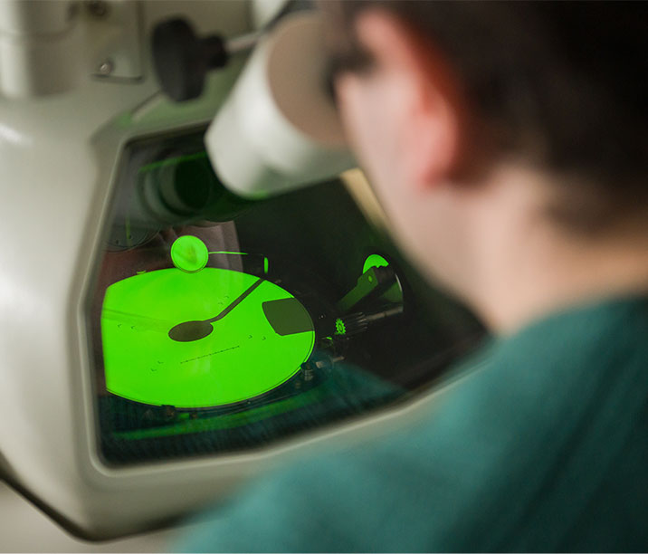 Researcher examining imaging device